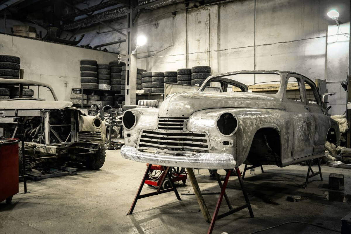 Stripped back car in mechanic workshop